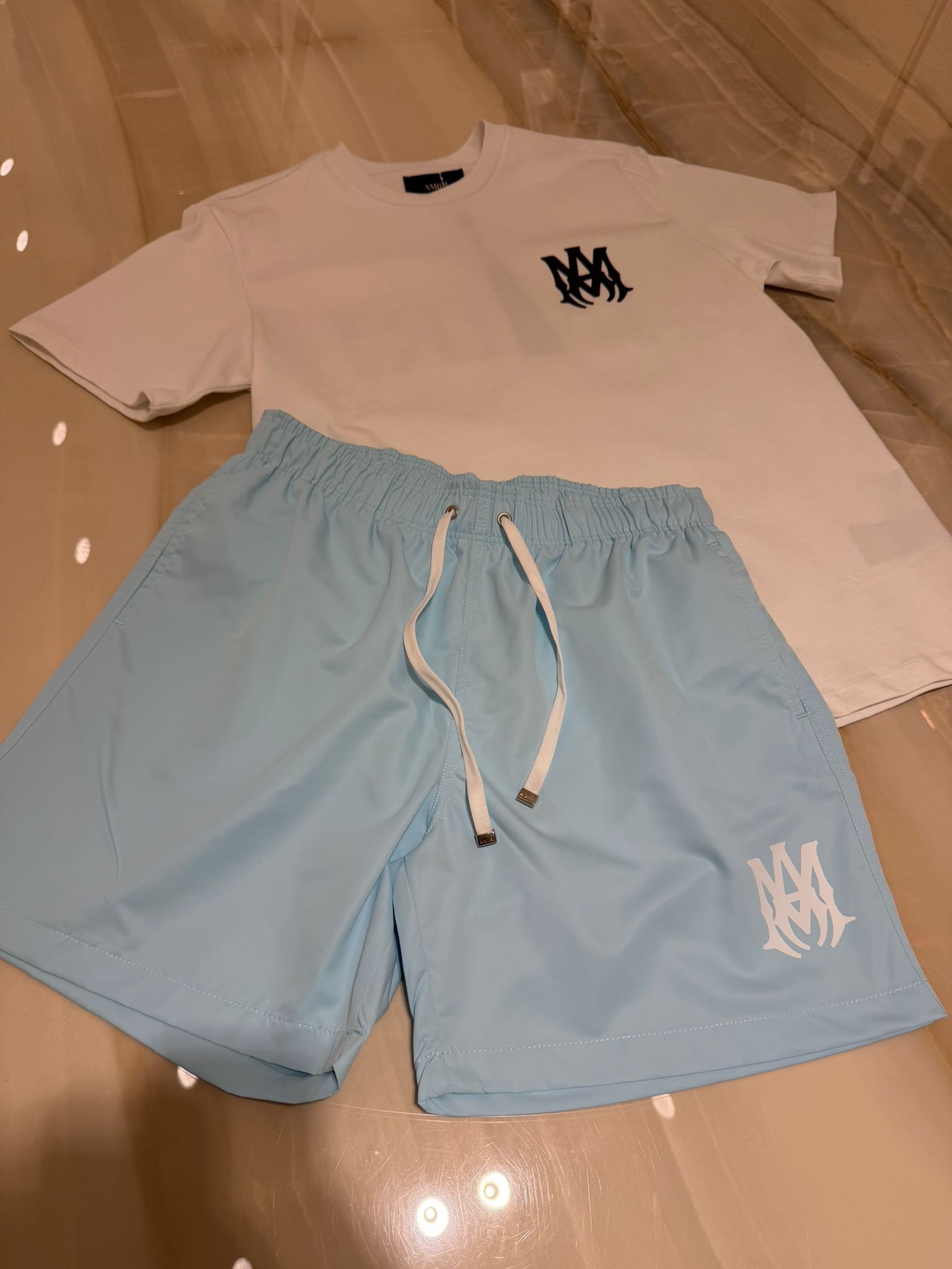 img_3036 Amiri Summer Set White T-Shirt & Baby Blue Swimshorts - Afbeelding 1